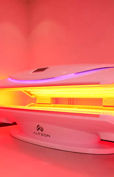 Red light therapy bed with glowing LED panels at HBOT Wellness Centre